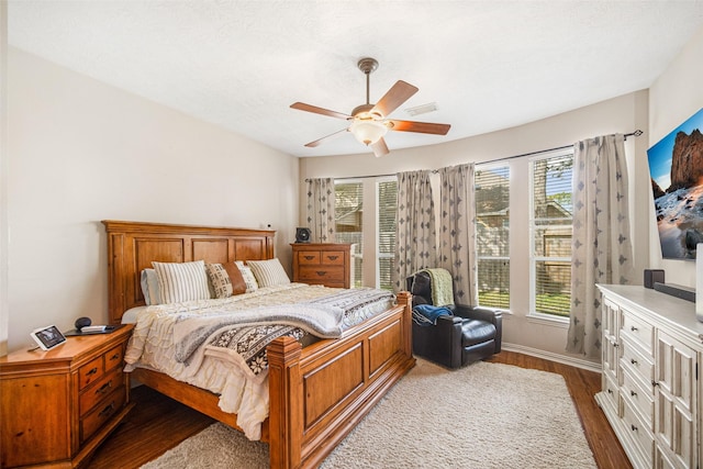 bedroom featuring wood-type flooring and ceiling fan