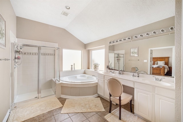 bathroom with lofted ceiling, vanity, tile patterned floors, and independent shower and bath