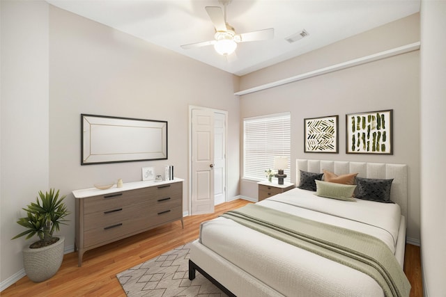 bedroom with ceiling fan and light hardwood / wood-style floors