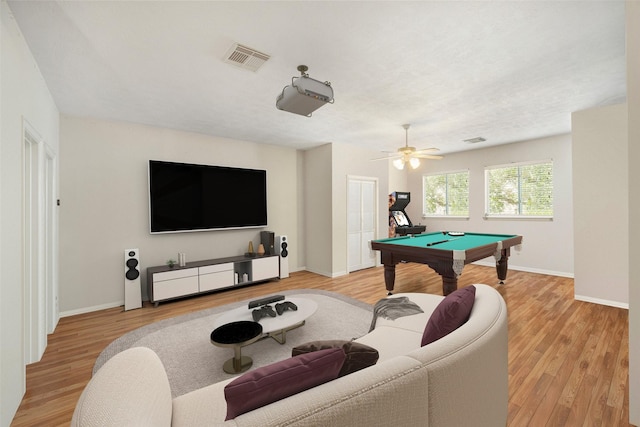 rec room with ceiling fan, pool table, and light wood-type flooring