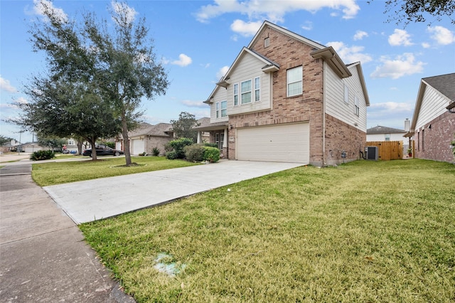 view of front of property with a garage and a front lawn