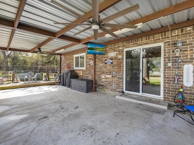 view of patio with ceiling fan and a grill