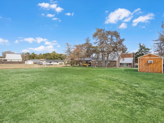 view of yard with a storage shed