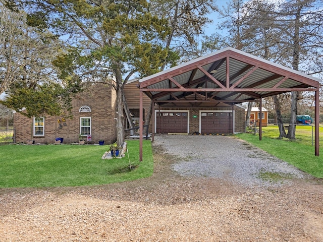 view of front of property featuring a garage and a front lawn