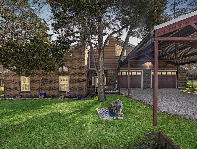 view of front facade featuring a garage, a front lawn, and a carport