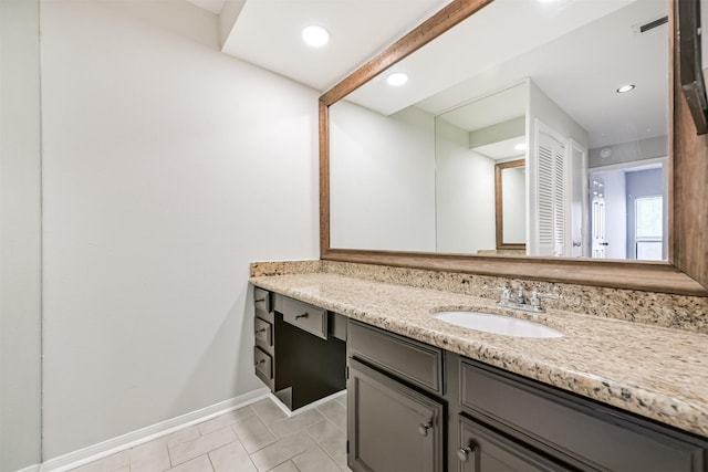 bathroom with tile patterned flooring and vanity