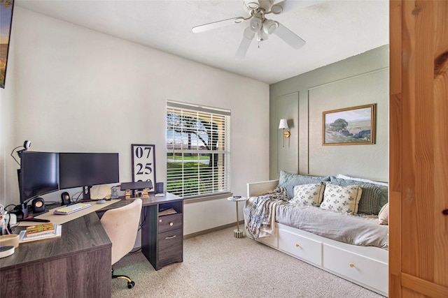 home office featuring light colored carpet and ceiling fan