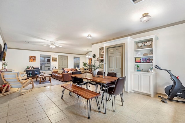 dining area with ceiling fan and light tile patterned flooring