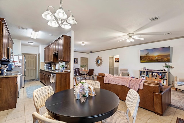 dining area featuring light tile patterned flooring, sink, ceiling fan with notable chandelier, and ornamental molding