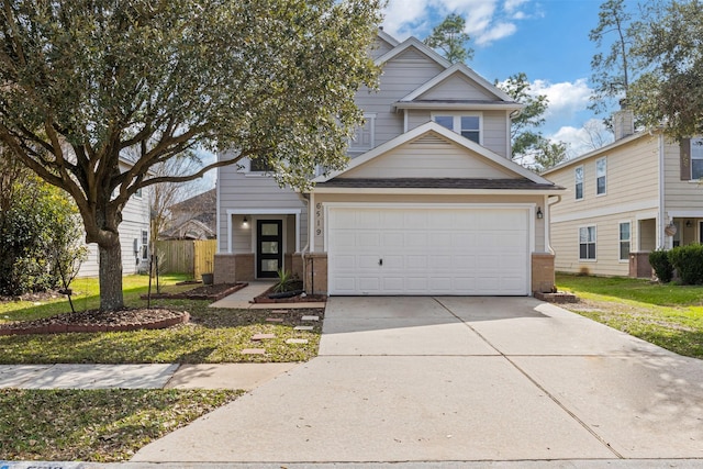 view of front of home with a garage and a front lawn