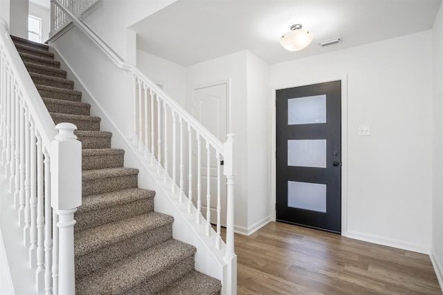 foyer entrance featuring hardwood / wood-style floors