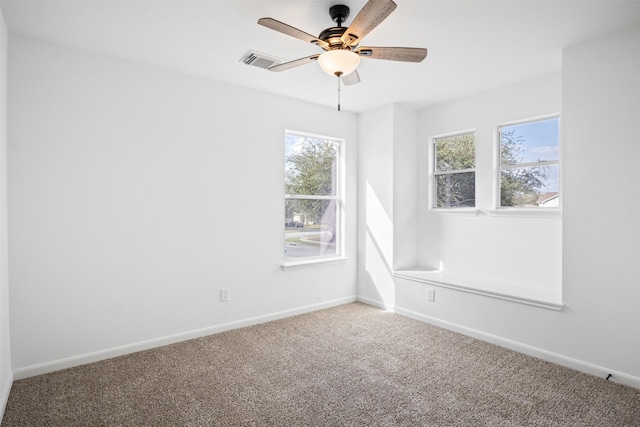 spare room with carpet floors and ceiling fan