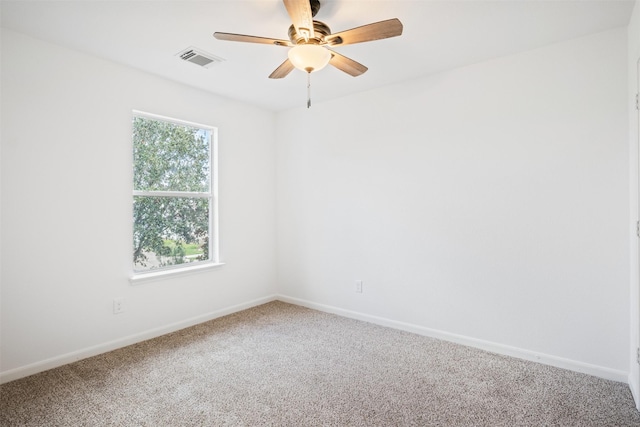 spare room with carpet floors and ceiling fan