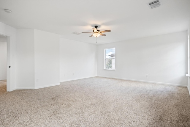 carpeted empty room with ceiling fan