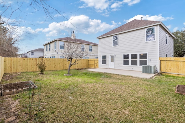 back of property with a patio, central AC unit, and a lawn