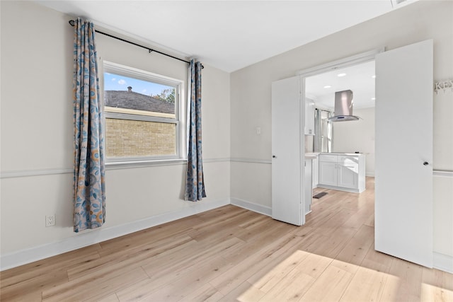 empty room with light wood-type flooring