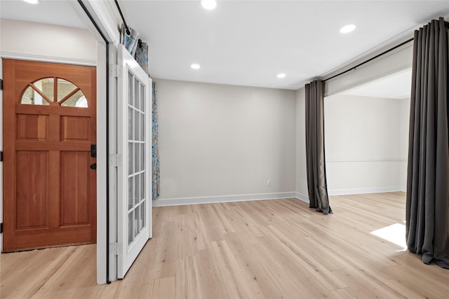 foyer with light hardwood / wood-style floors