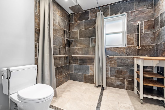 bathroom with toilet and a shower with shower curtain