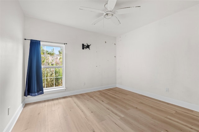 spare room featuring ceiling fan and light hardwood / wood-style floors