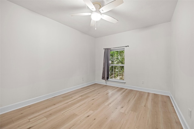 unfurnished room featuring ceiling fan and light hardwood / wood-style flooring