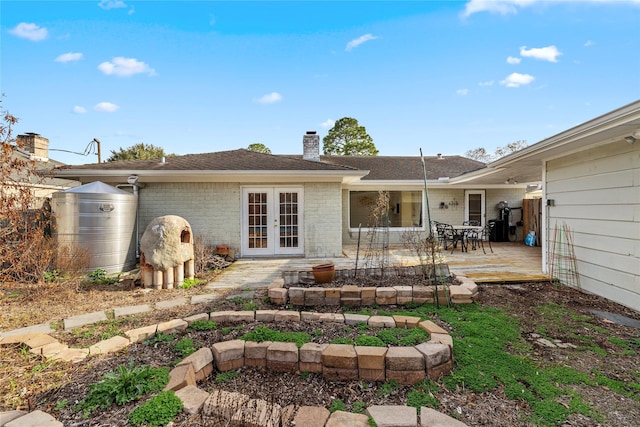 rear view of house with a patio and french doors