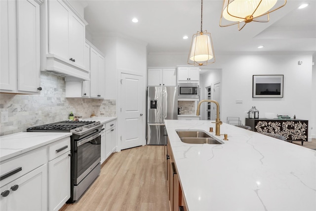 kitchen featuring white cabinetry and appliances with stainless steel finishes