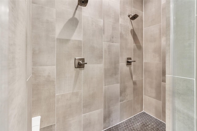 bathroom with a tile shower