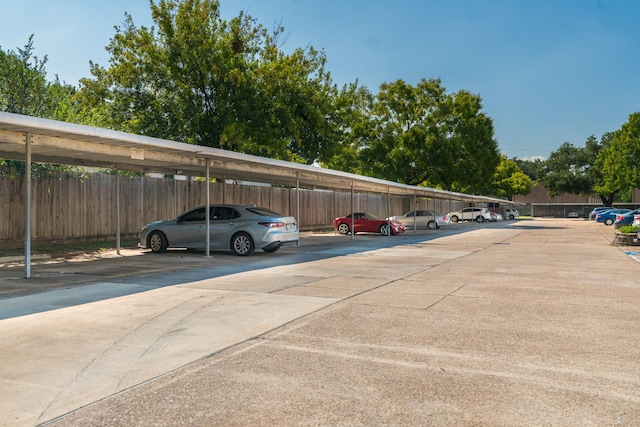 view of parking / parking lot with a carport