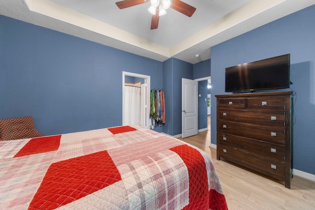 bedroom with ceiling fan and light hardwood / wood-style flooring