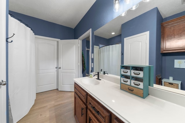 bathroom featuring vanity and hardwood / wood-style floors