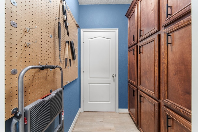 interior space featuring cabinets and light hardwood / wood-style flooring