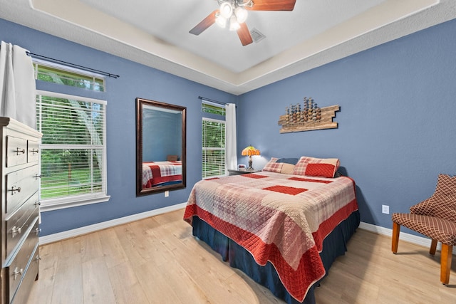 bedroom featuring ceiling fan and light hardwood / wood-style flooring