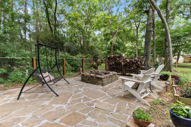 view of patio featuring an outdoor fire pit