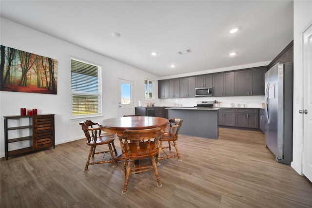 dining area with light wood-type flooring