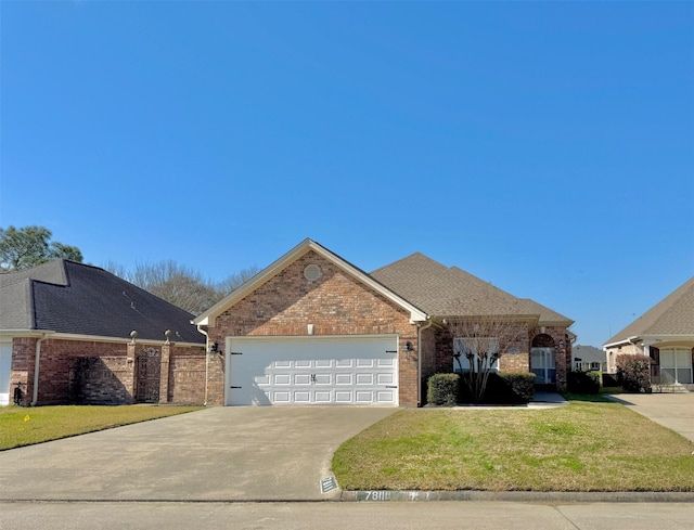 ranch-style home featuring an attached garage, brick siding, fence, concrete driveway, and a front lawn