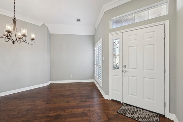 entrance foyer featuring dark wood-type flooring, visible vents, ornamental molding, and baseboards