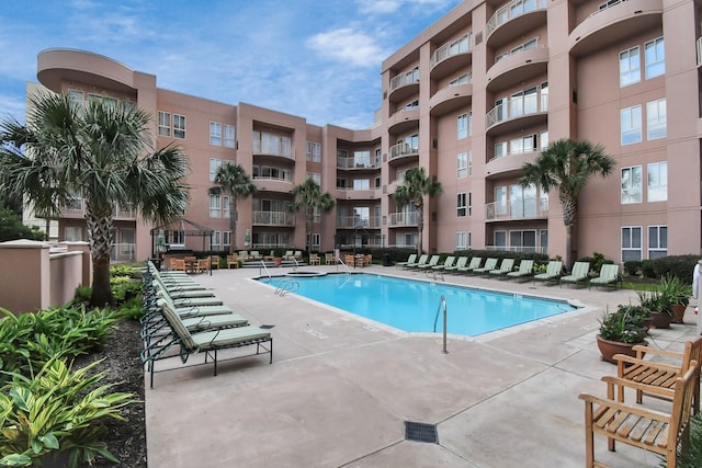 view of swimming pool featuring a patio area