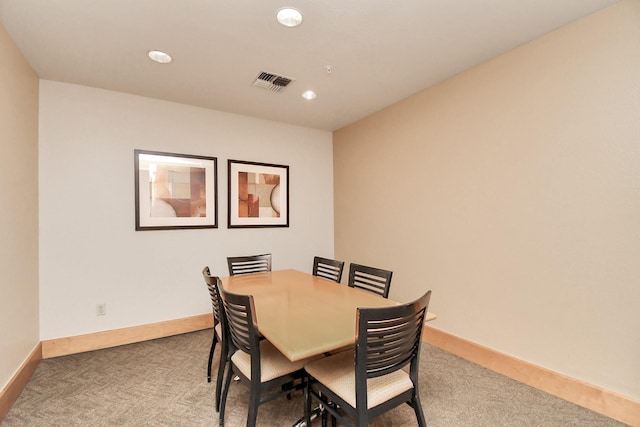 dining space with carpet