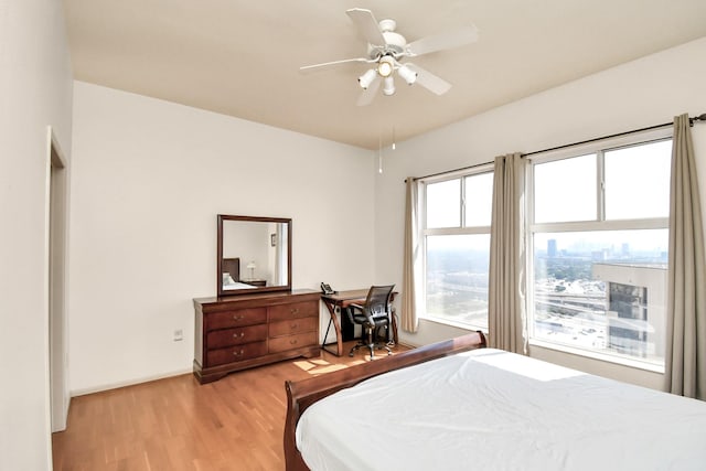 bedroom featuring ceiling fan and light hardwood / wood-style flooring