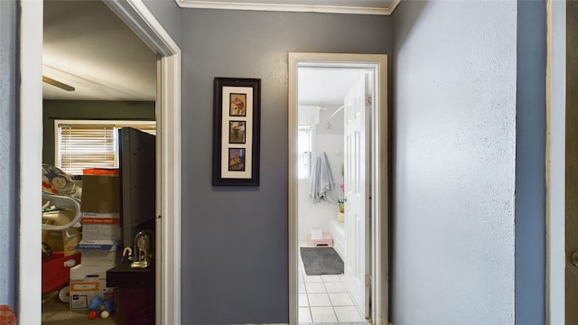 hall featuring light tile patterned floors