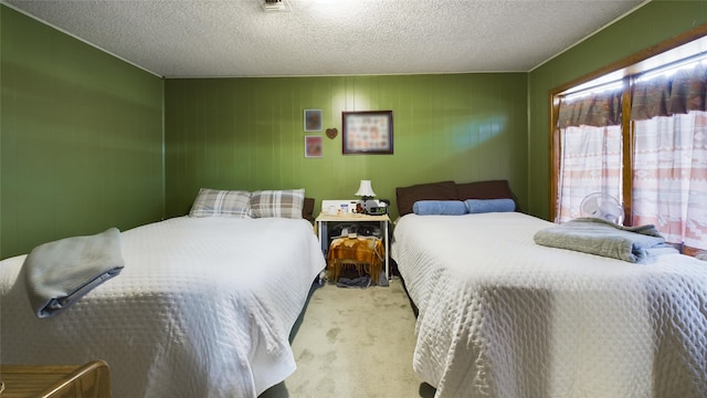 carpeted bedroom with a textured ceiling