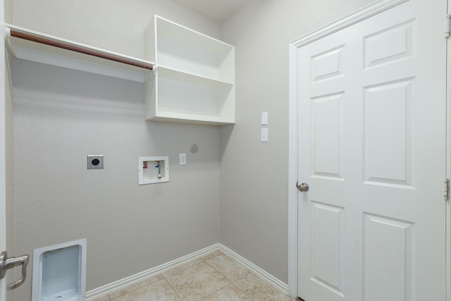 clothes washing area with gas dryer hookup, electric dryer hookup, washer hookup, and light tile patterned floors