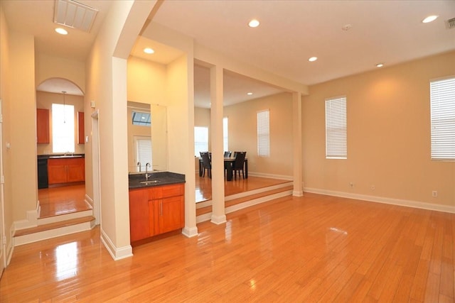 interior space featuring sink and light hardwood / wood-style flooring