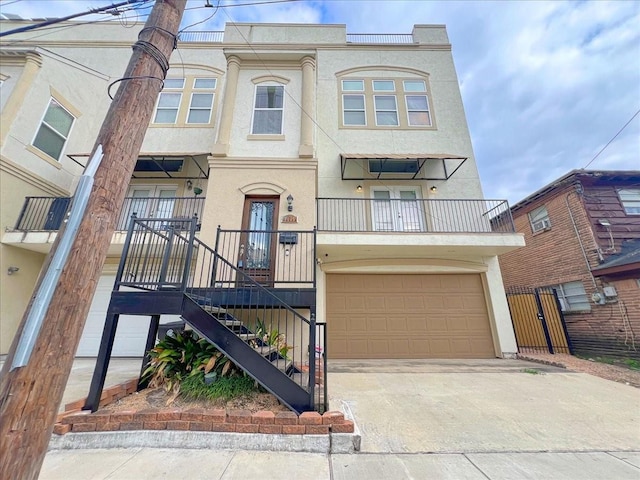 multi unit property with a garage and a balcony