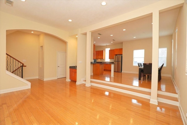 unfurnished living room with light hardwood / wood-style floors