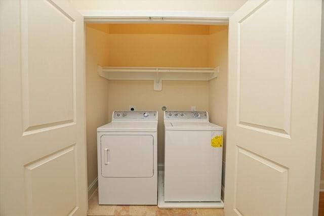 laundry room with separate washer and dryer