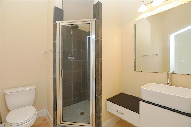 bathroom with an enclosed shower, vanity, and toilet