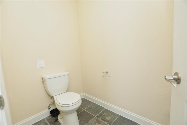 bathroom featuring tile patterned floors and toilet