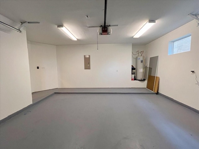 garage with a garage door opener, electric water heater, and electric panel