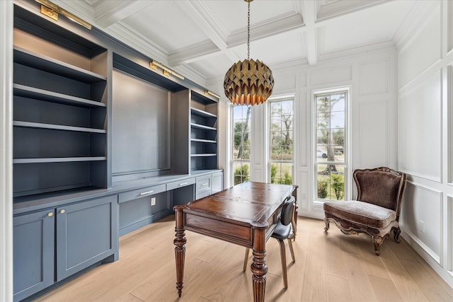 home office featuring crown molding, light hardwood / wood-style flooring, built in features, coffered ceiling, and beamed ceiling